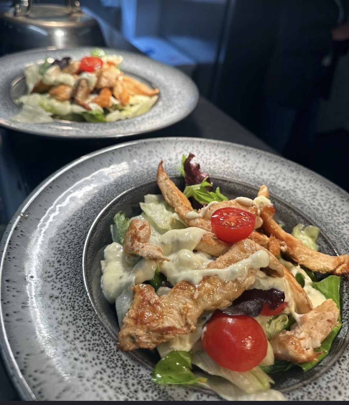 Grilled chicken salad plated at Brownmoor Bistro